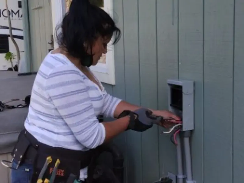 Licensed electrician wiring an exterior subpanel in Pevely